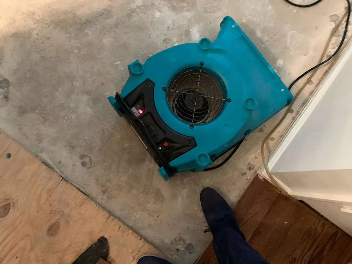 Air mover drying subfloor during Leak Detection & Repair in Visalia
